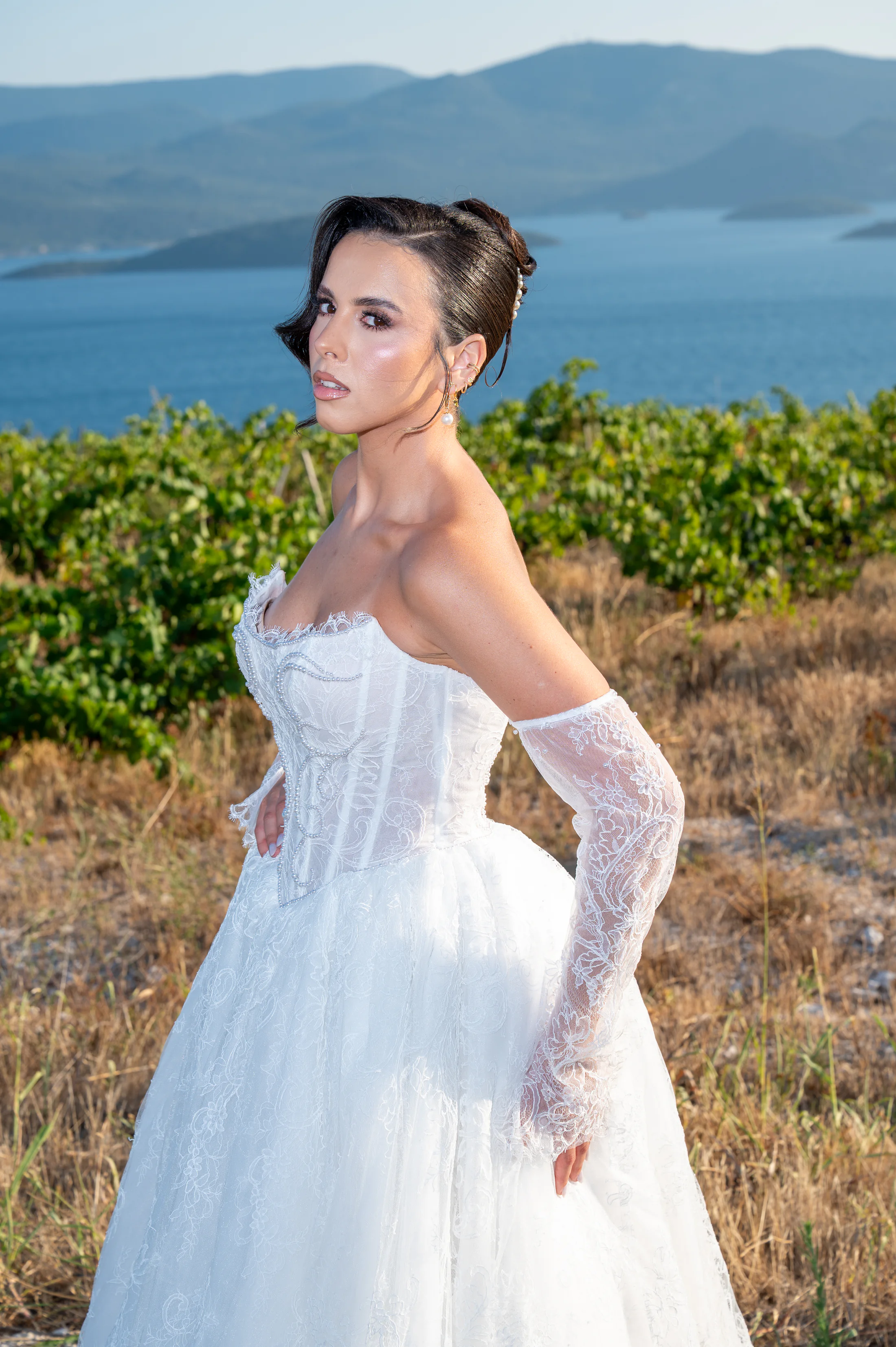Editorial bridal portrait in a Mediterranean vineyard