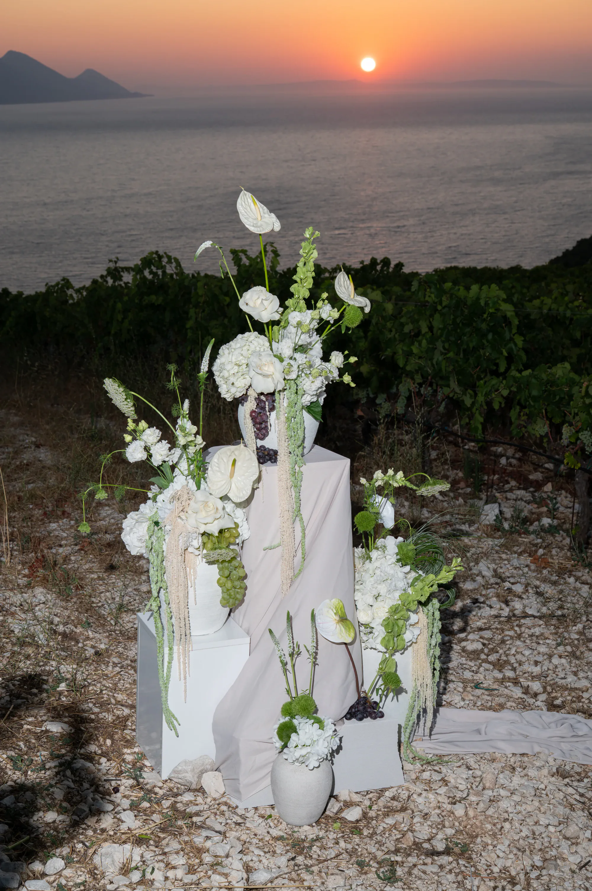 White floral wedding installation overlooking the Adriatic