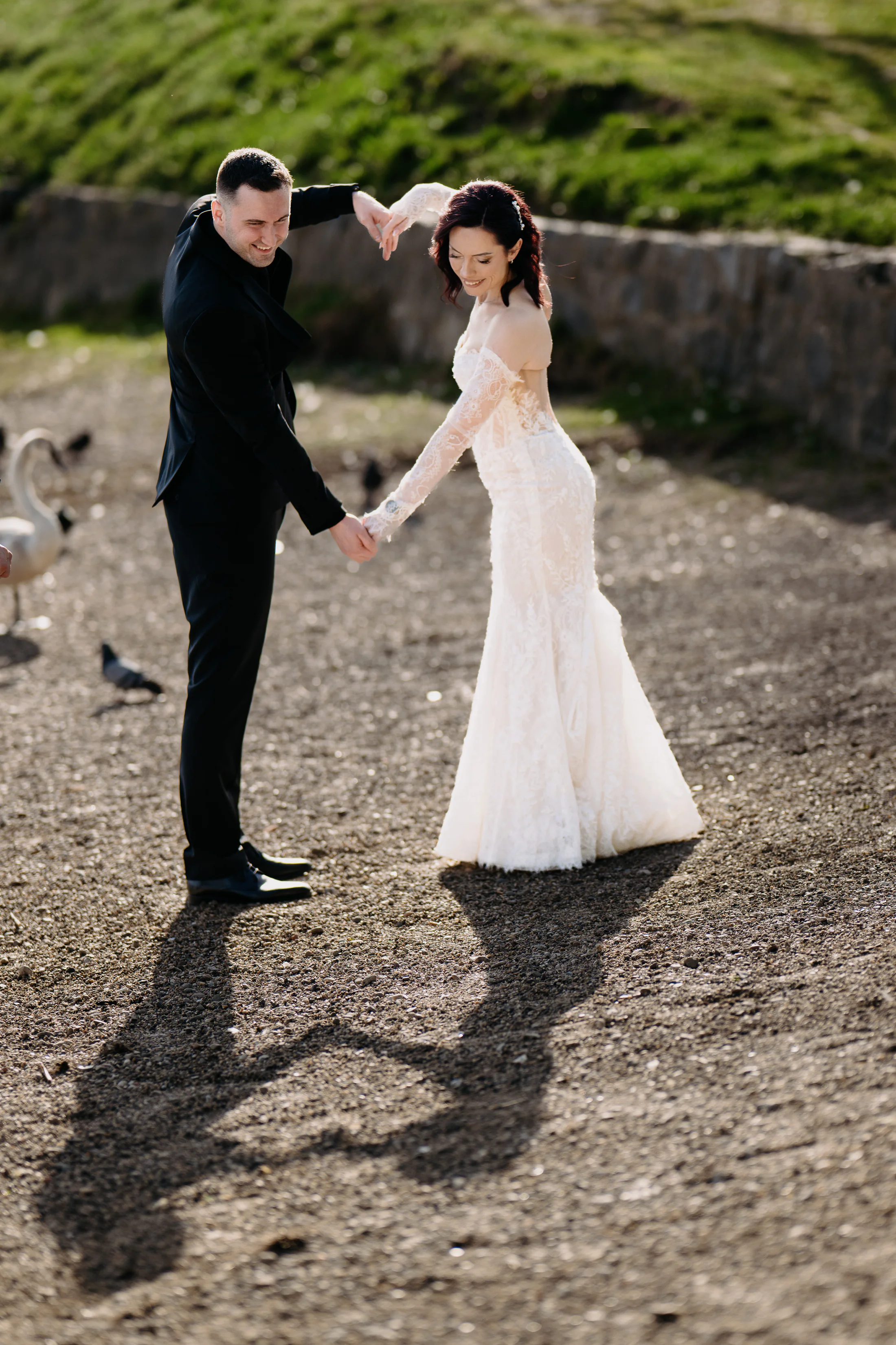 Bride and groom moving together outdoors